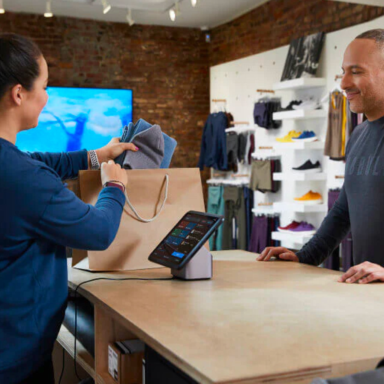 Person checking out using Shopify POS